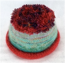 Red and aqua fluffy crown hat